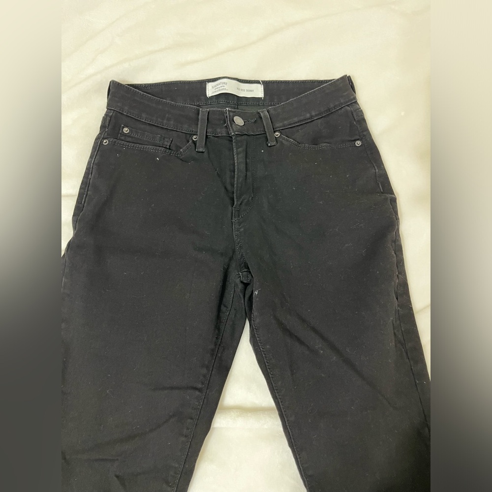 Mid rise skinny jeans.